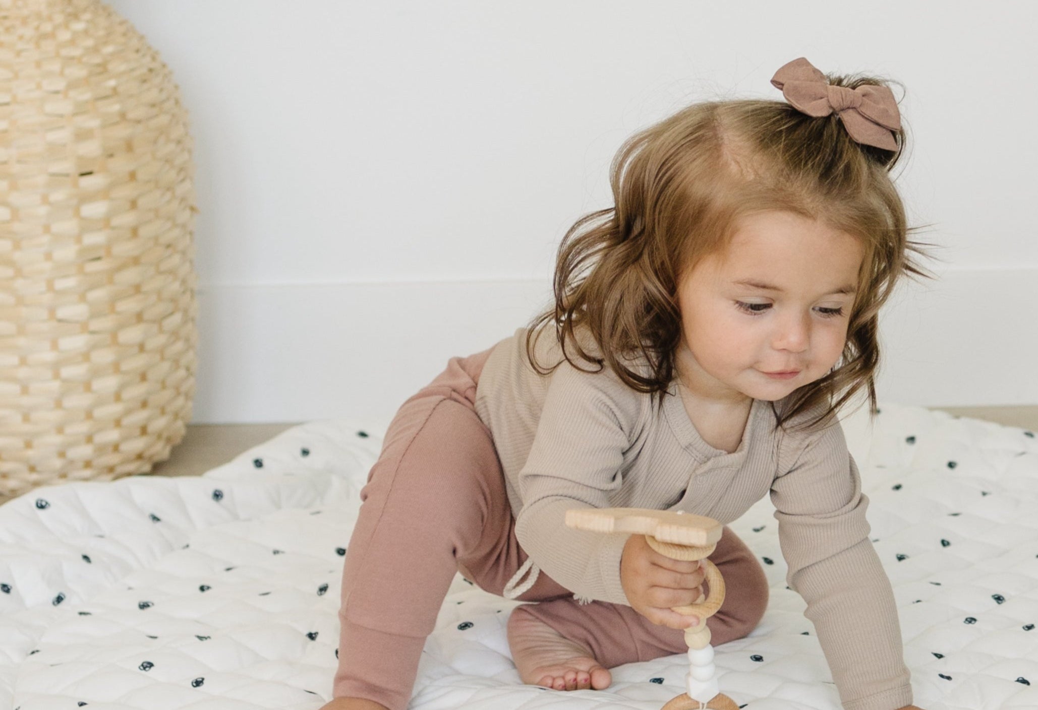 Cozy, padded baby play mat in a soothing pastel color, perfect for a nursery.
