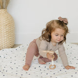 Cozy, padded baby play mat in a soothing pastel color, perfect for a nursery.