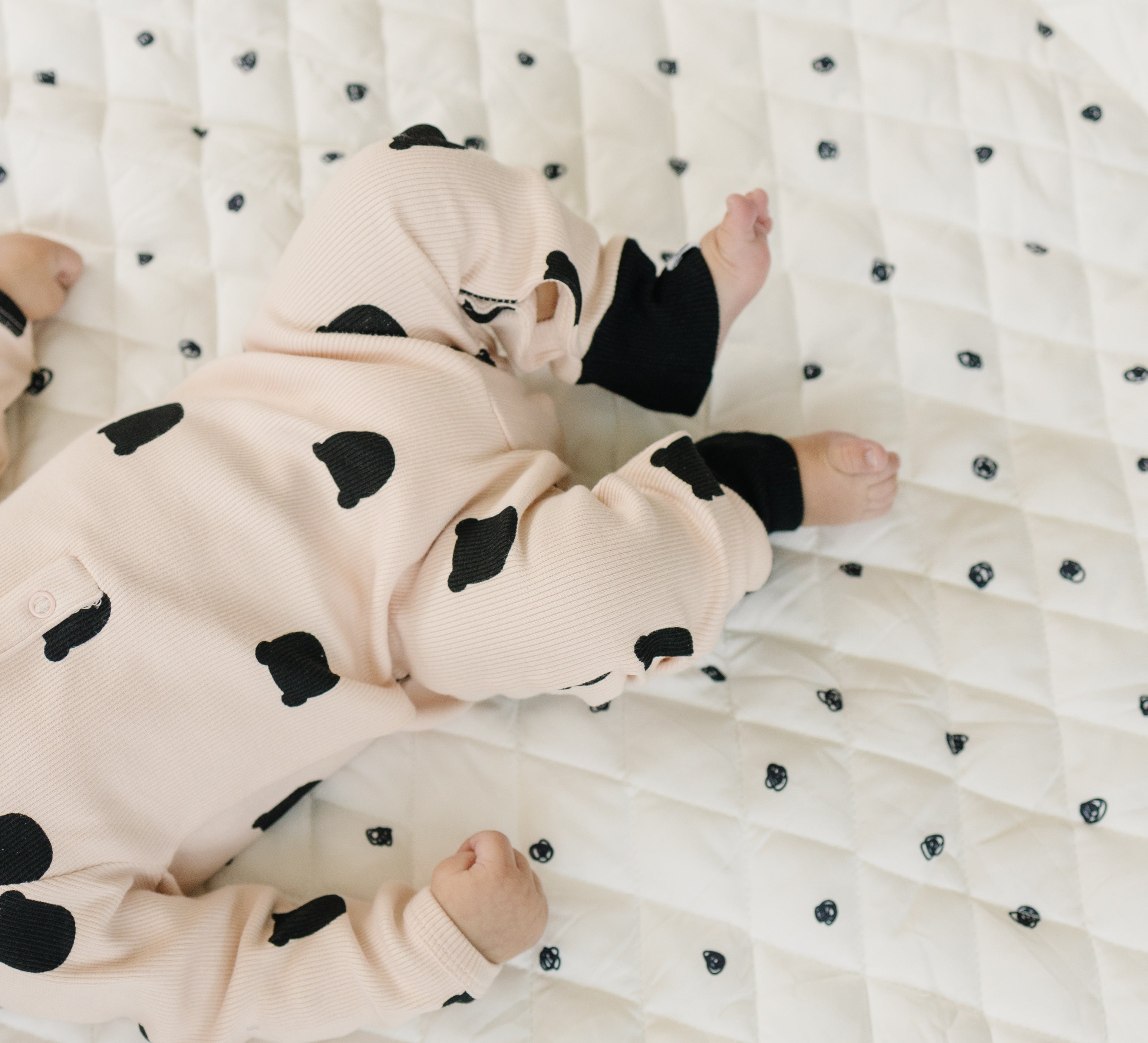 Soft, padded baby play mat with vibrant, contrasting colors and playful patterns.