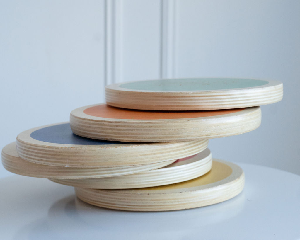 Side view of wood stepping stones showing their stackable design