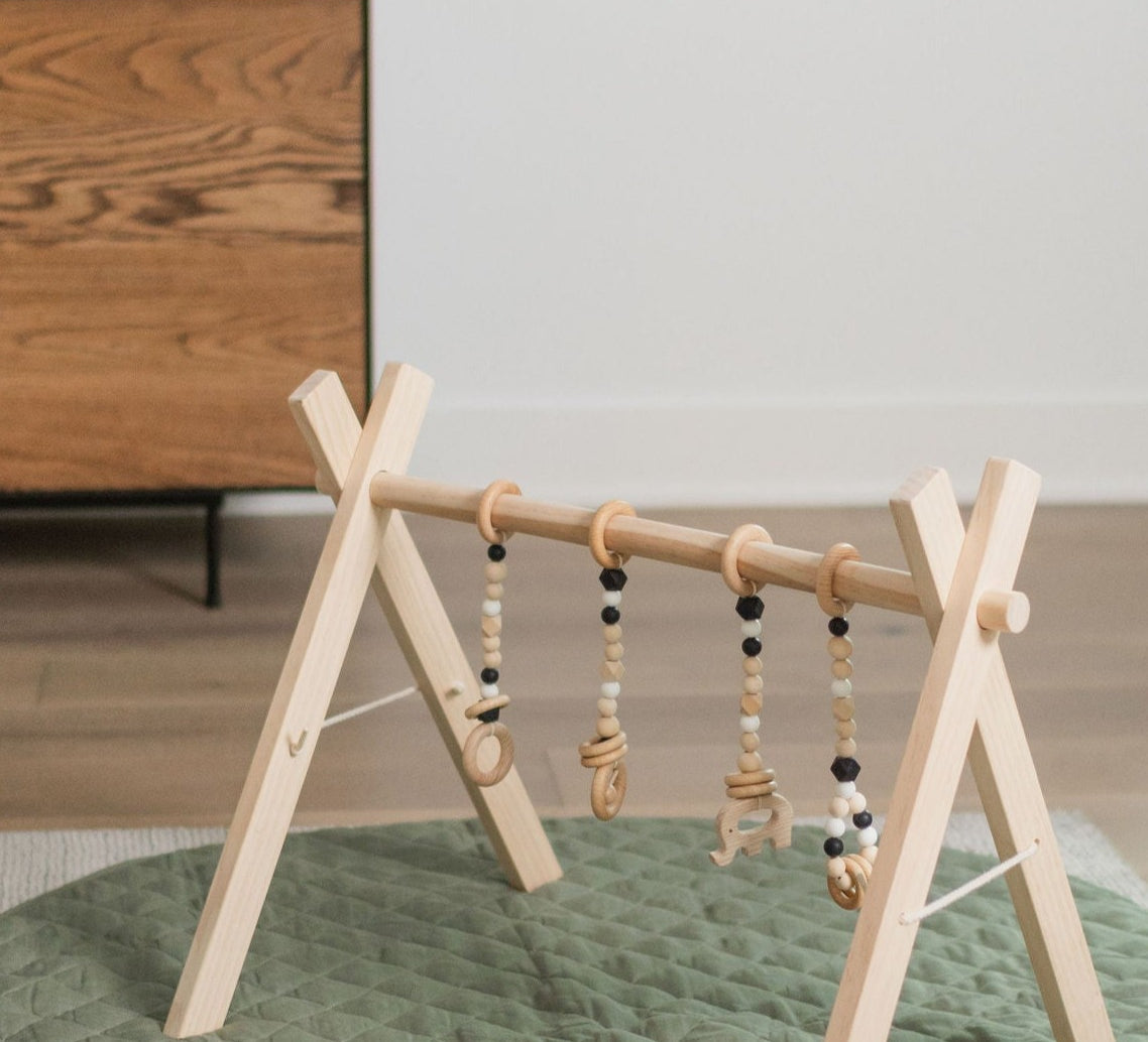 Wooden baby gym, natural wooden frame.