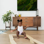 Wooden balance beam enhances children's coordination.