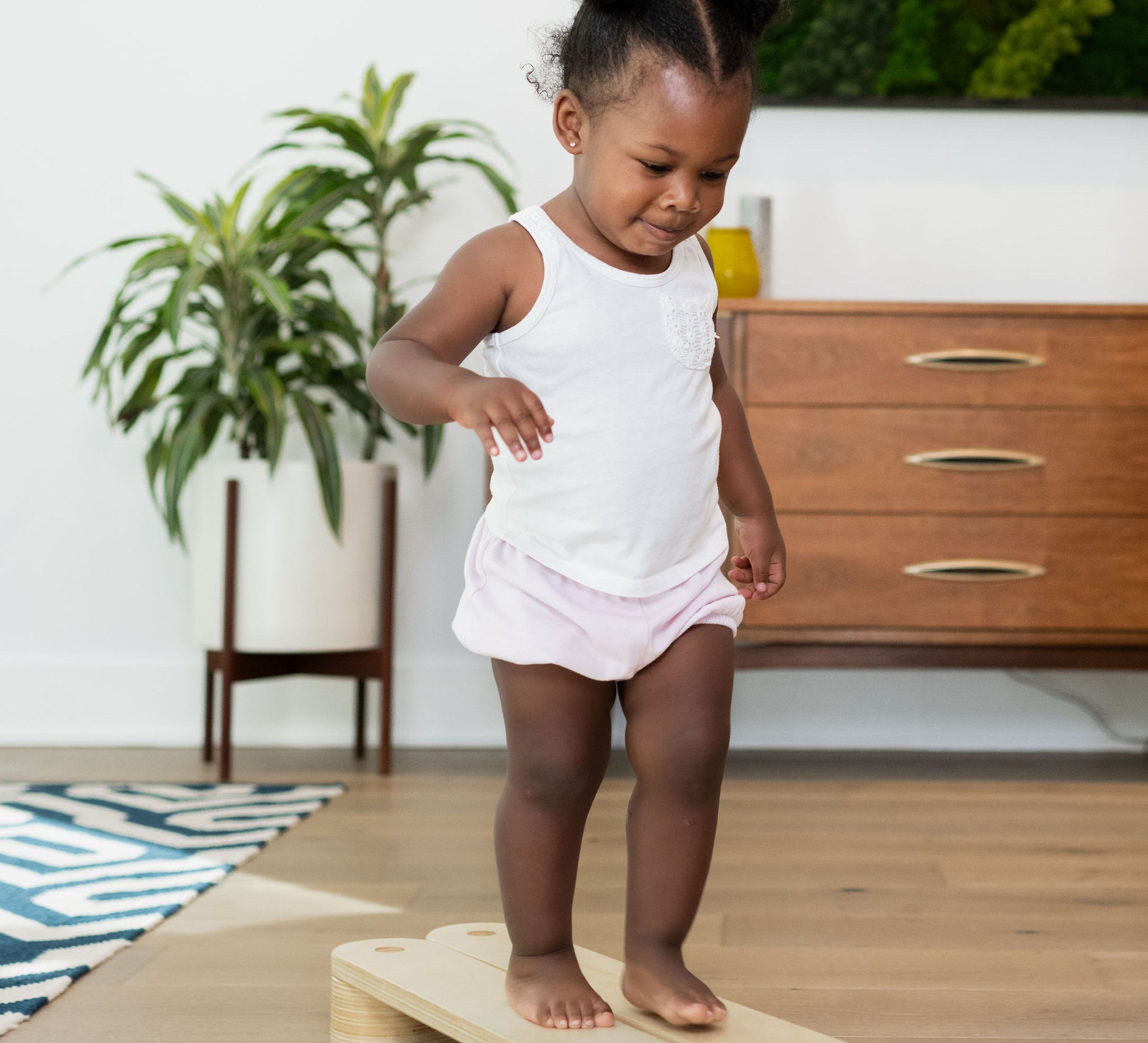 Sturdy wooden balance beam for toddlers.