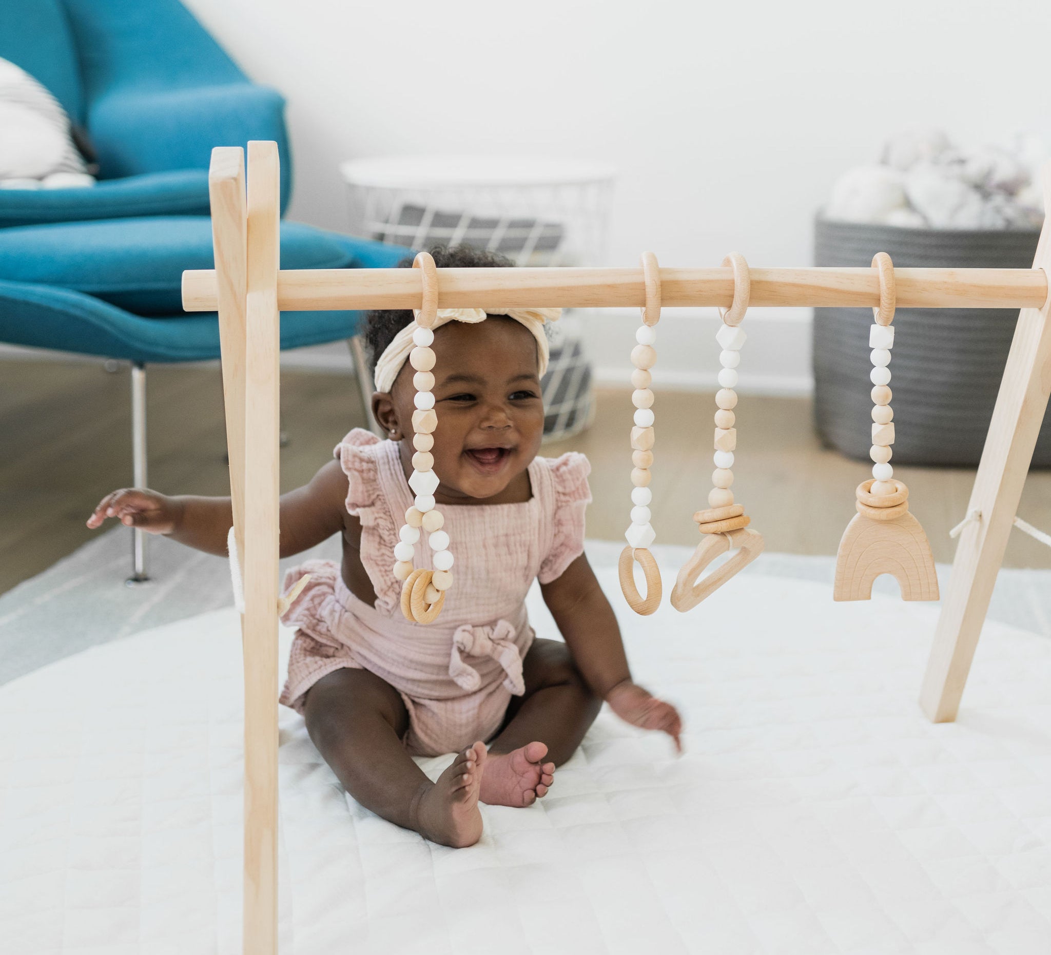 Wooden baby gym with natural frame