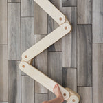 Elegant wooden balance beam for kids' exercise.