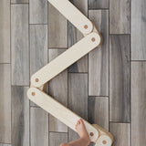 Elegant wooden balance beam for kids' exercise.