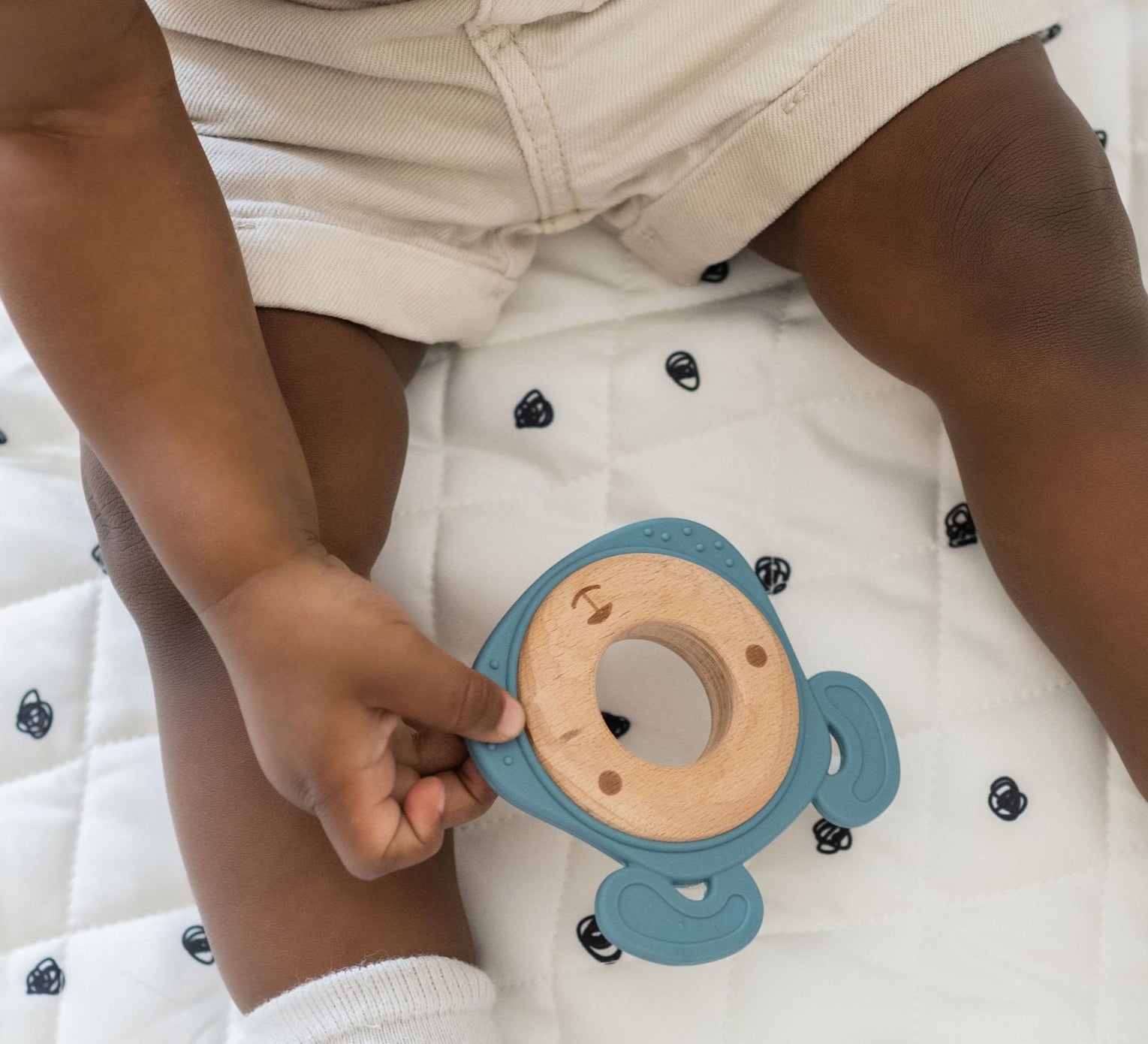 Side-by-side comparison of silicone and wood teethers, highlighting their combined durability and softness