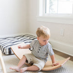 Wooden balance board enhances balance and strength.