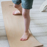 Durable wooden balance board for toddlers.