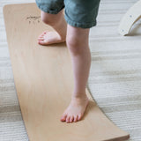 Durable wooden balance board for toddlers.