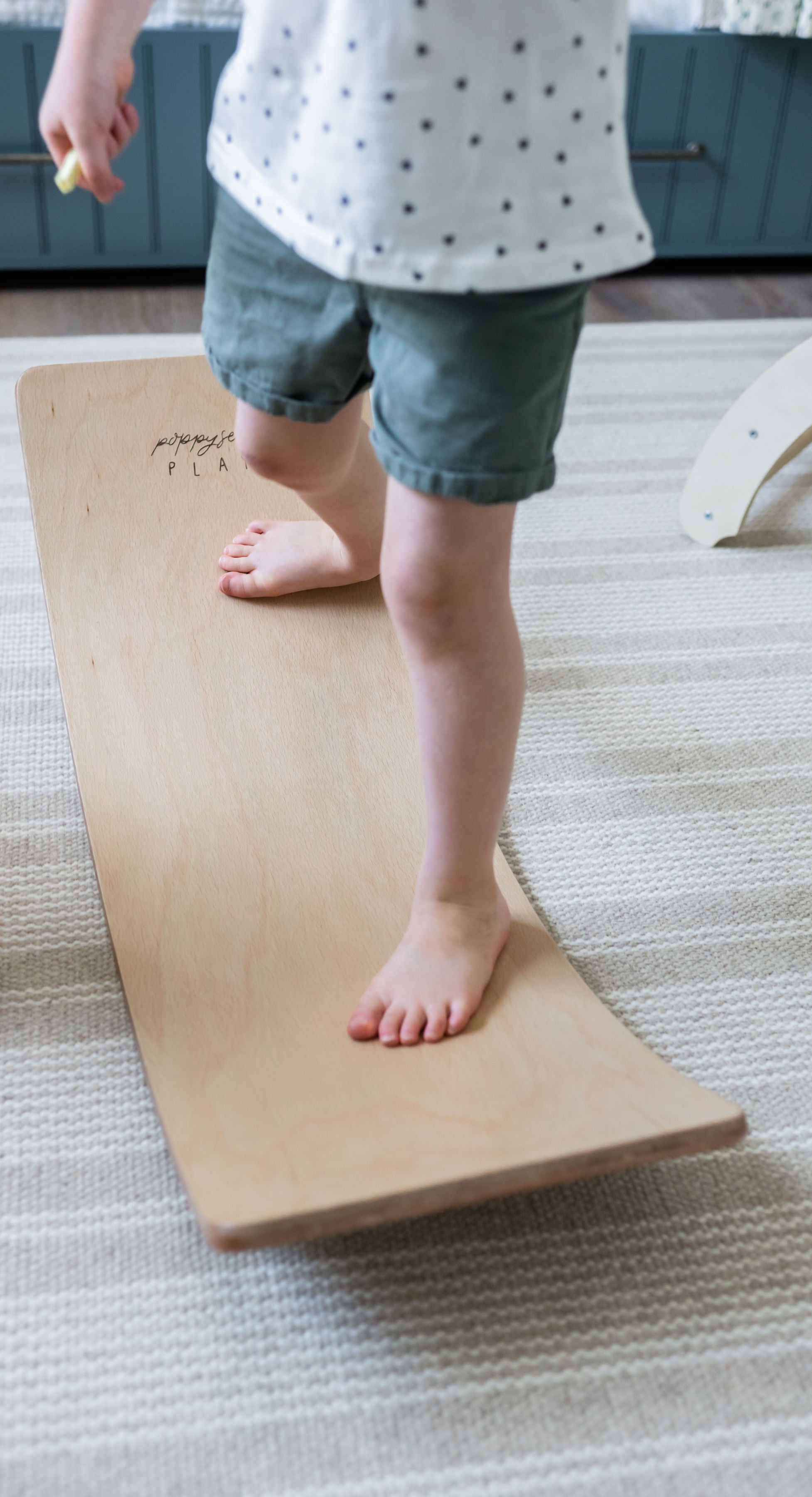 Durable wooden balance board for toddlers.