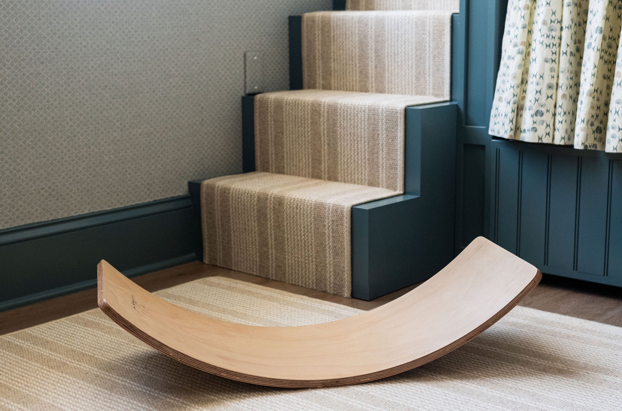 Stylish wooden balance board for kids' coordination.