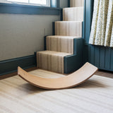 Stylish wooden balance board for kids' coordination.