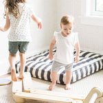 Safe wooden balance beam for early walkers.