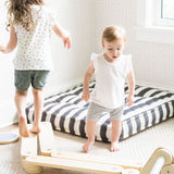 Safe wooden balance beam for early walkers.