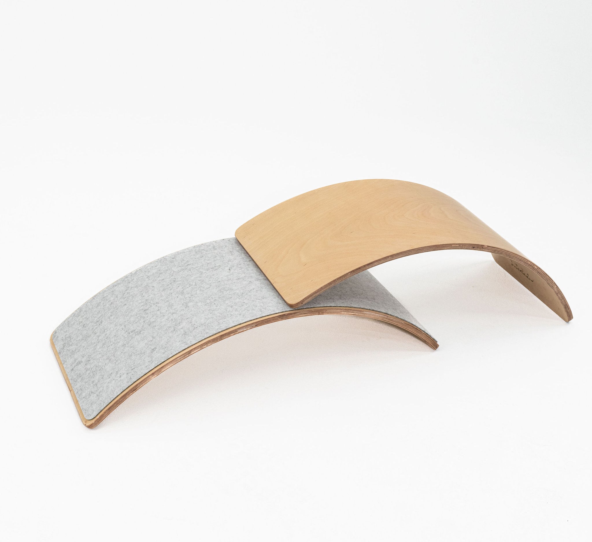 Safe wooden balance board for developmental play.