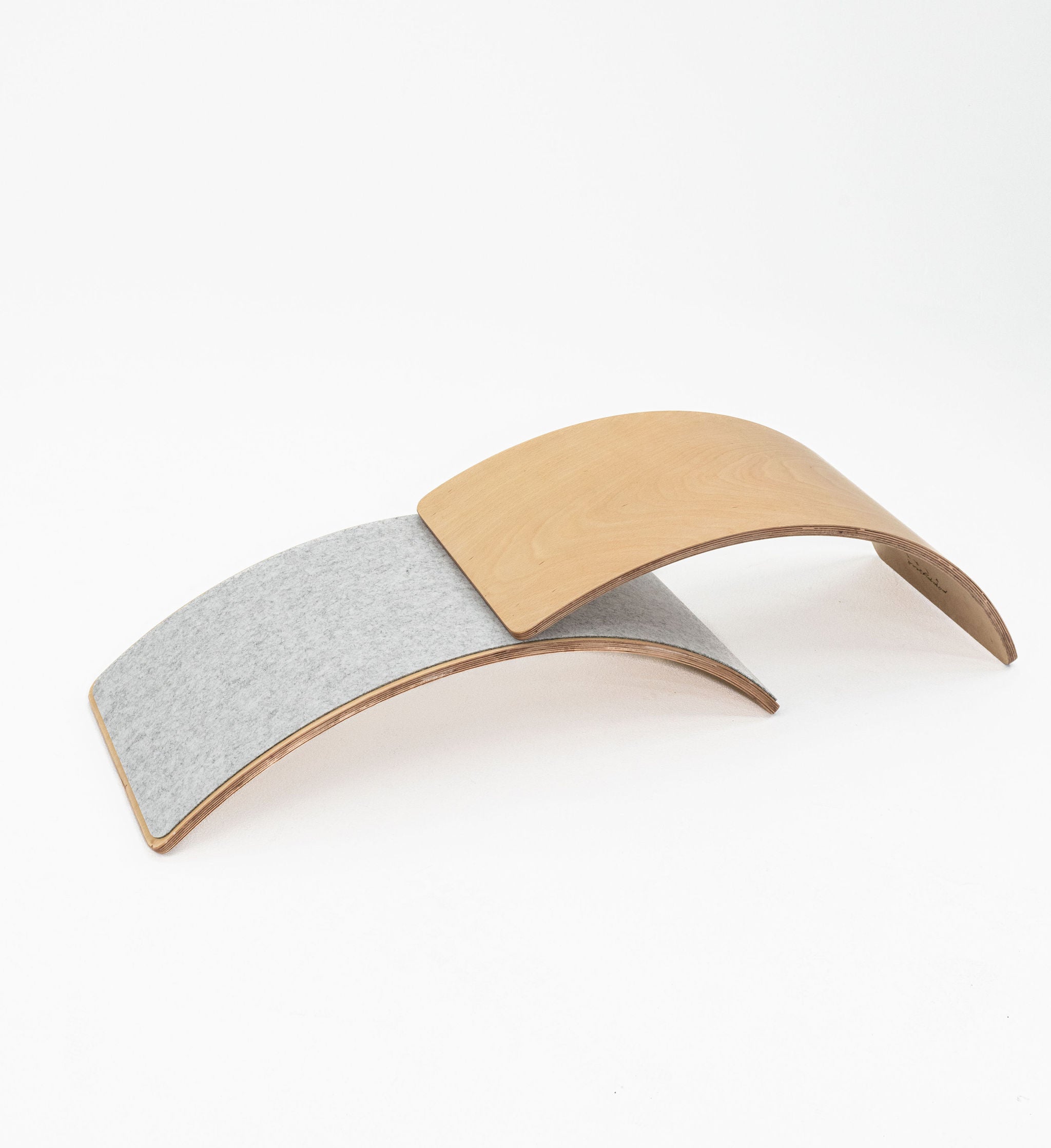 Safe wooden balance board for developmental play.