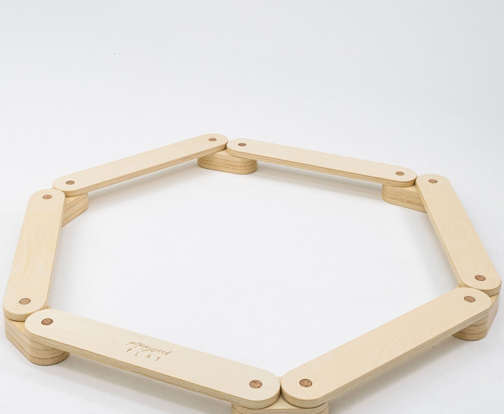 Wooden balance beam designed for children's fun.