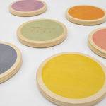 Wood stepping stones displayed in a natural outdoor setting.