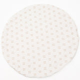 Infant lying comfortably on a thick, padded play mat with educational shapes and textures.