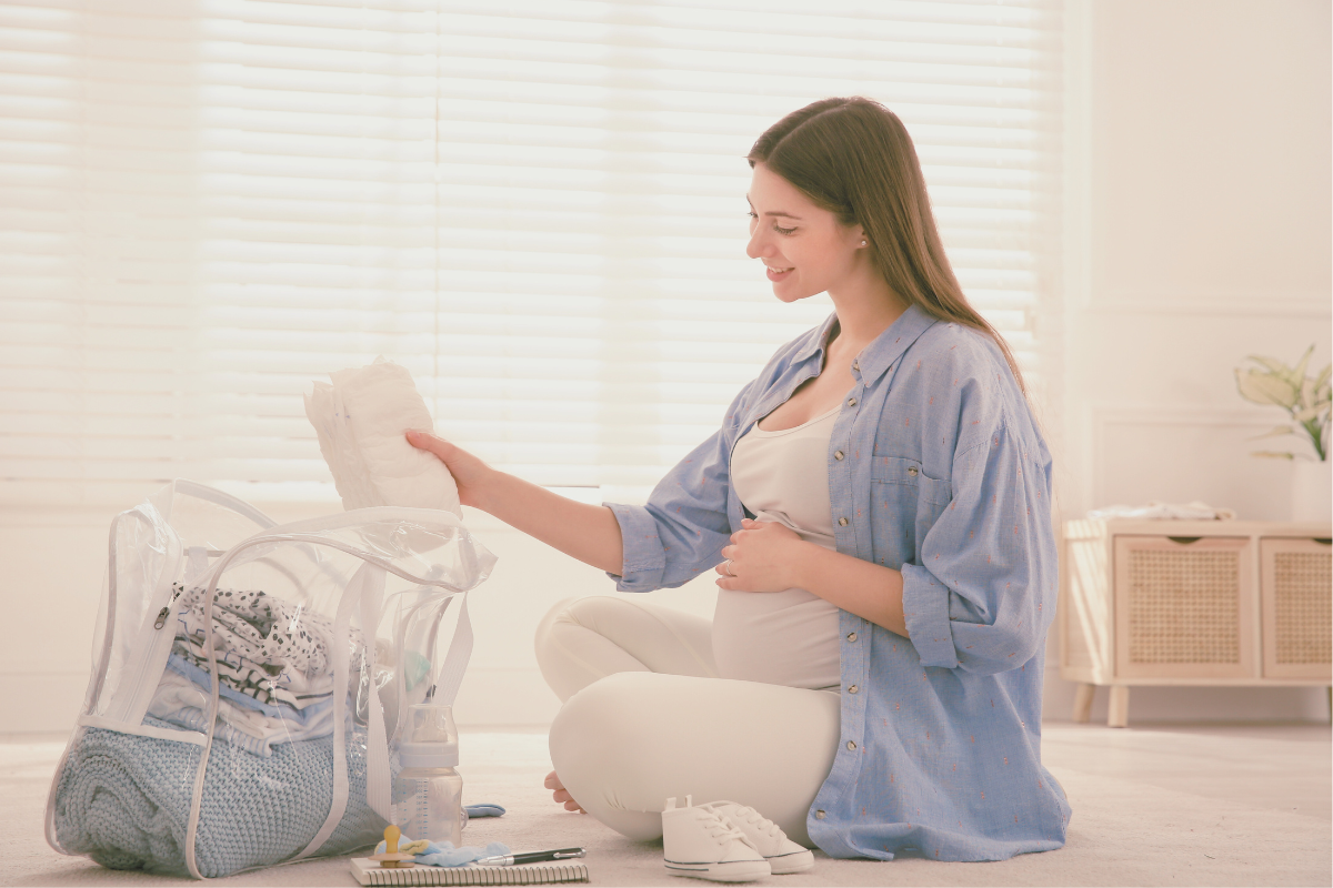 Pregnant woman packing hospital bag