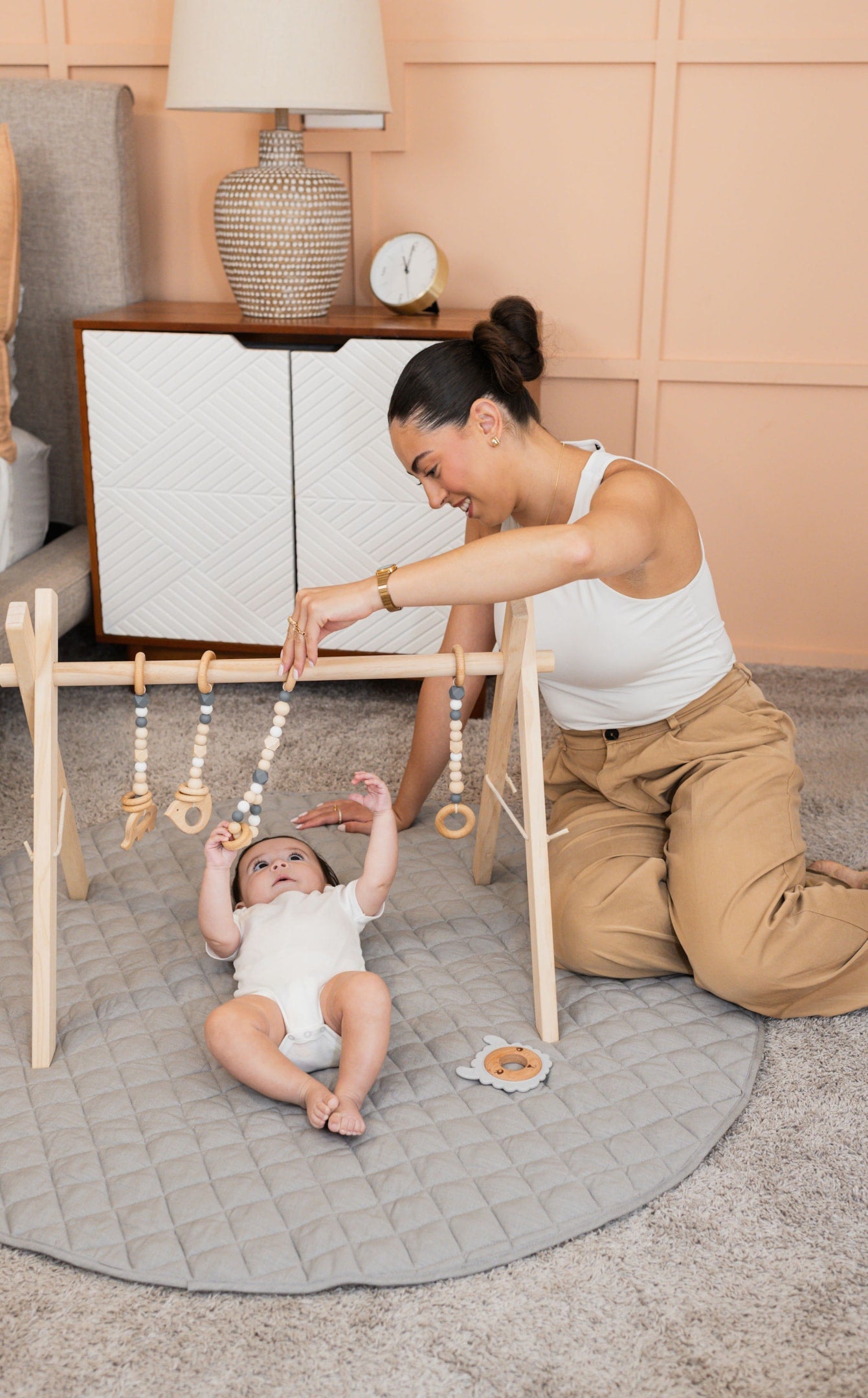 Poppyseed Play Baby Gym with baby and mom