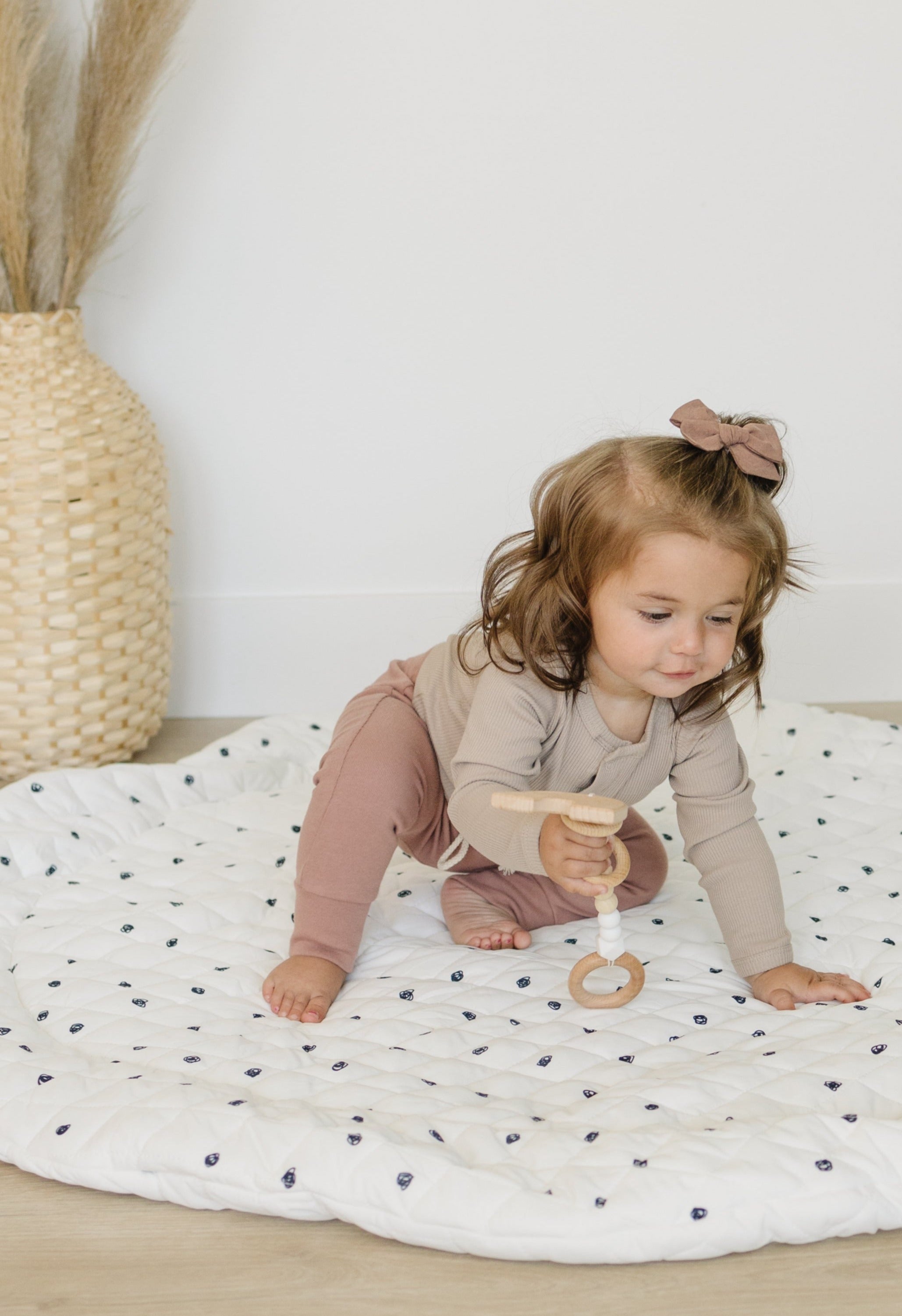 Cozy, padded baby play mat in a soothing pastel color, perfect for a nursery.
