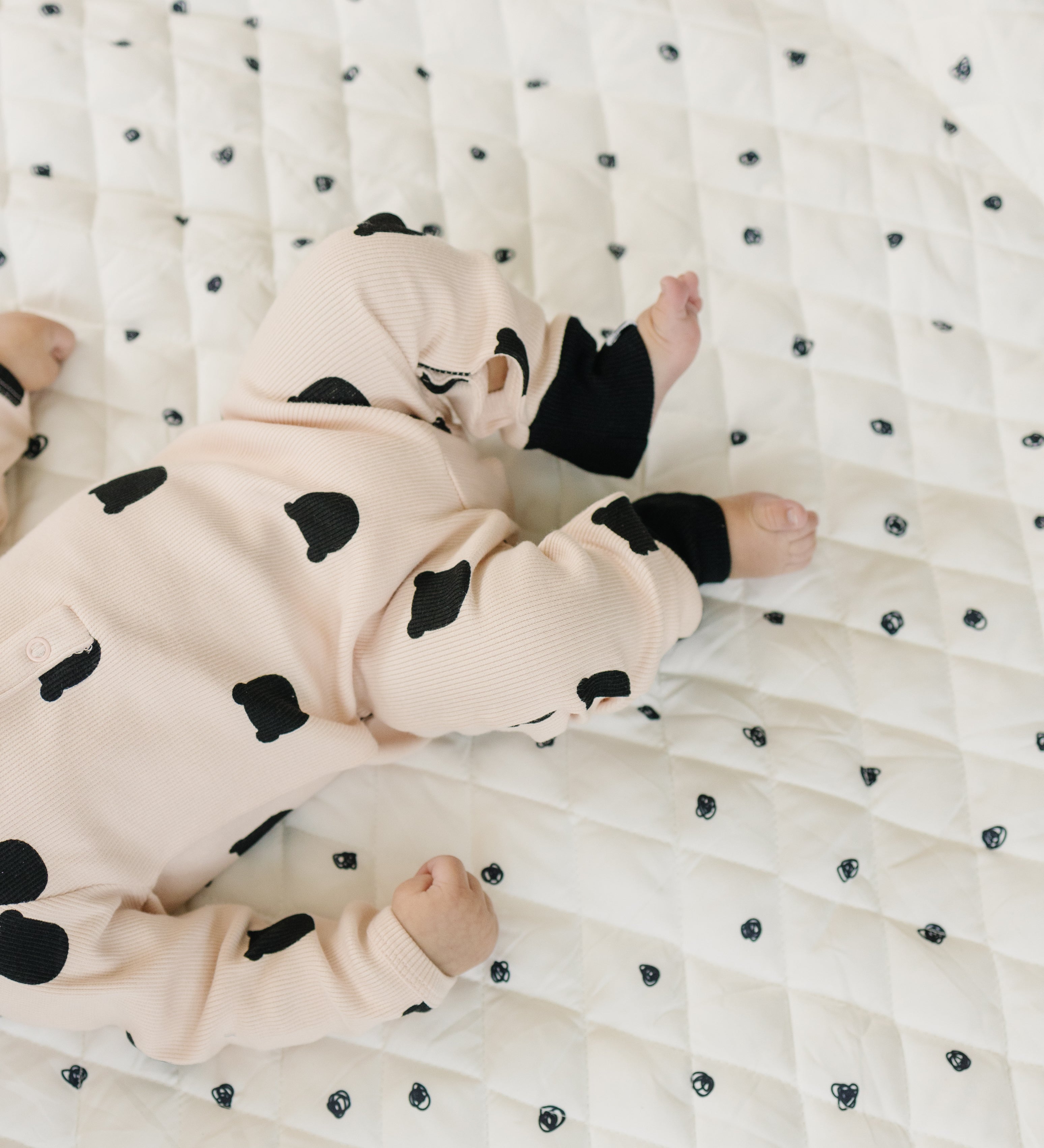 Soft, padded baby play mat with vibrant, contrasting colors and playful patterns.