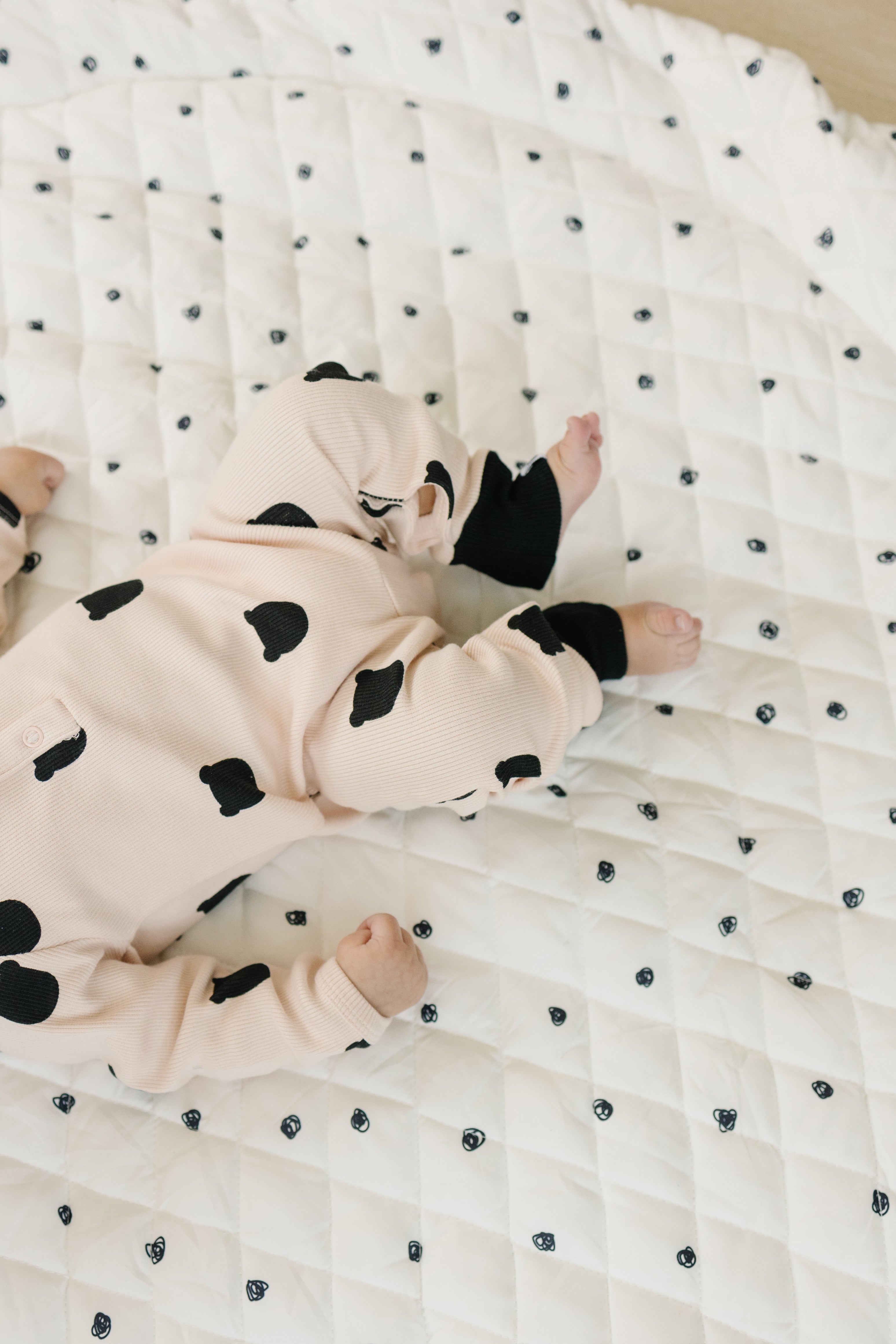 Soft, padded baby play mat with vibrant, contrasting colors and playful patterns.