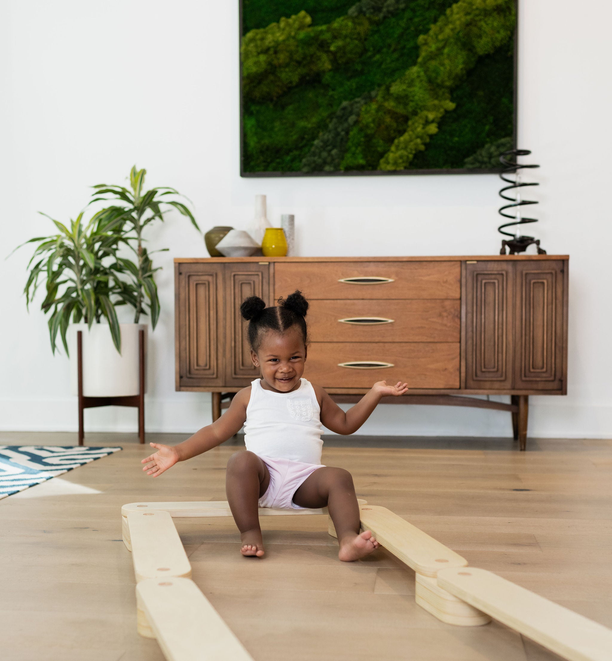 Wooden balance beam enhances children's coordination.