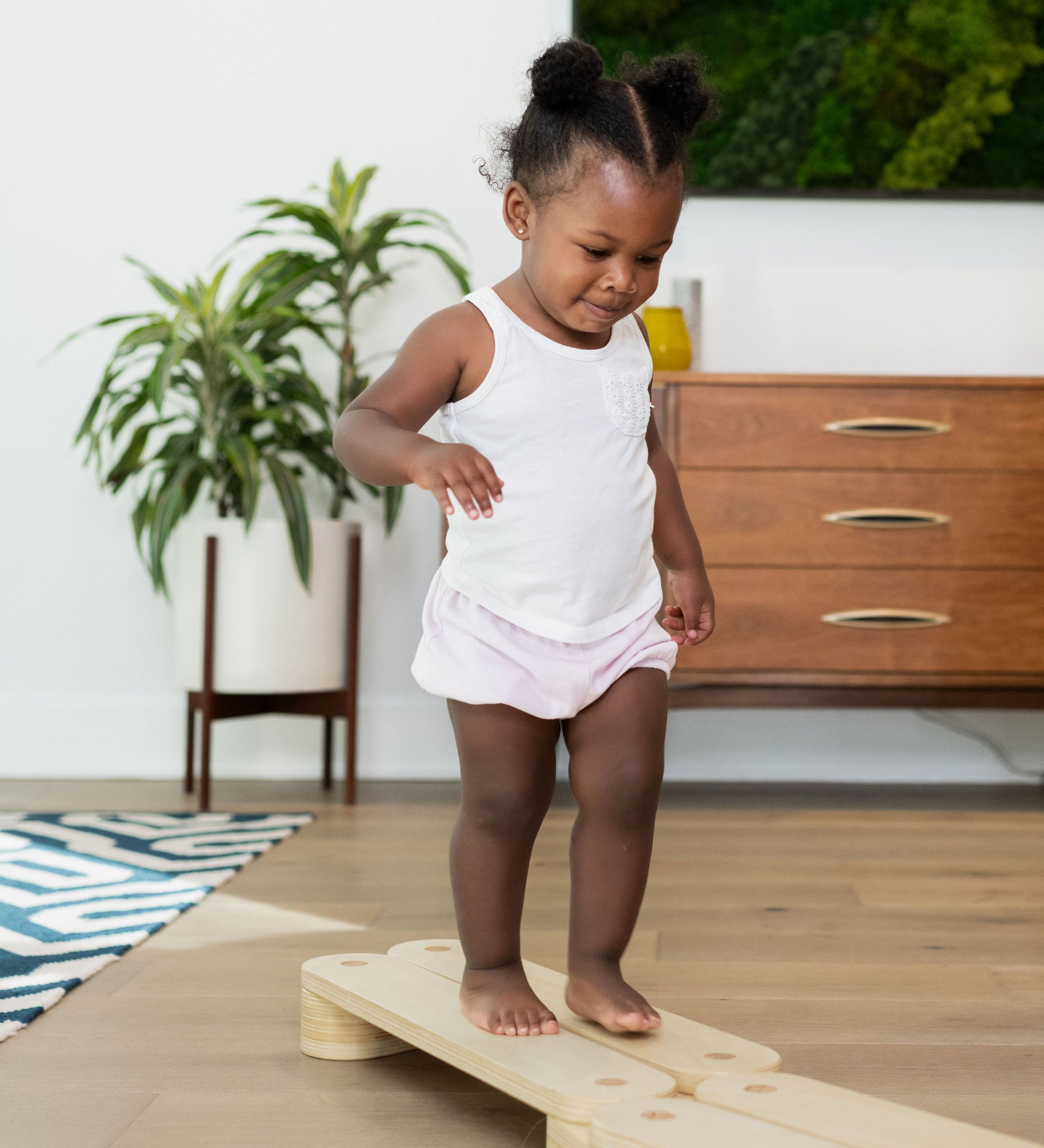 Sturdy wooden balance beam for toddlers.