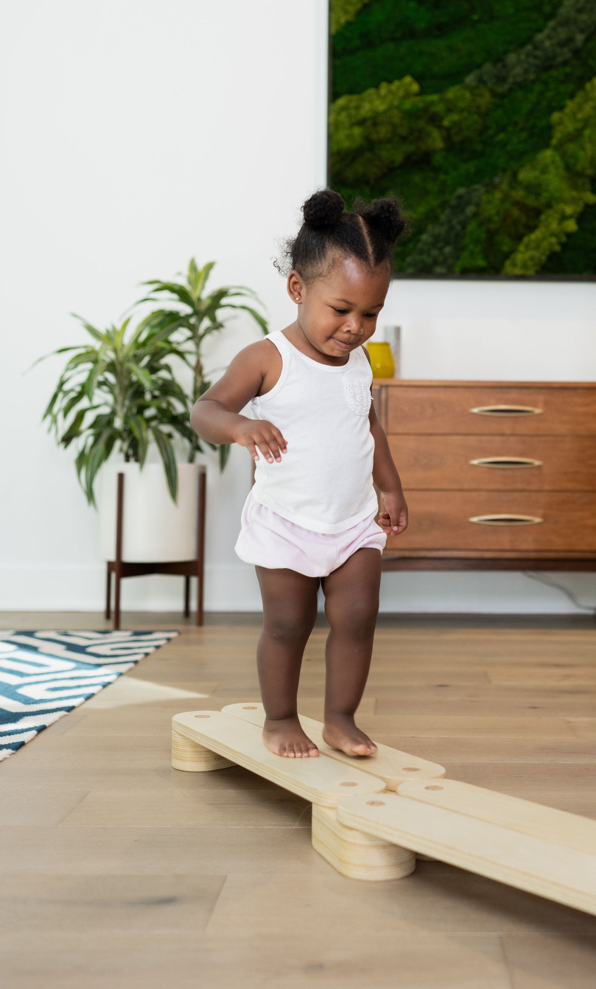 Sturdy wooden balance beam for toddlers.