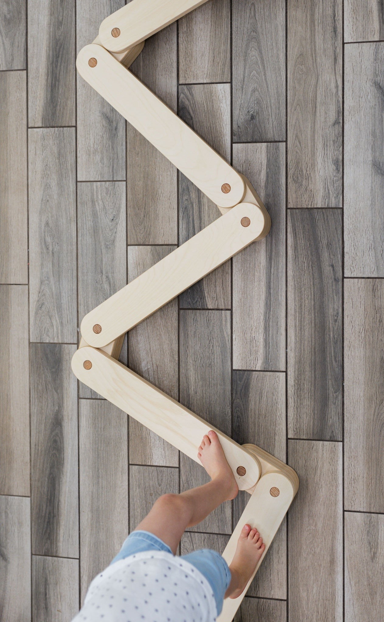 Elegant wooden balance beam for kids' exercise.