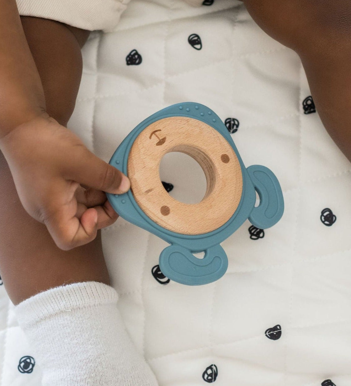 Side-by-side comparison of silicone and wood teethers, highlighting their combined durability and softness