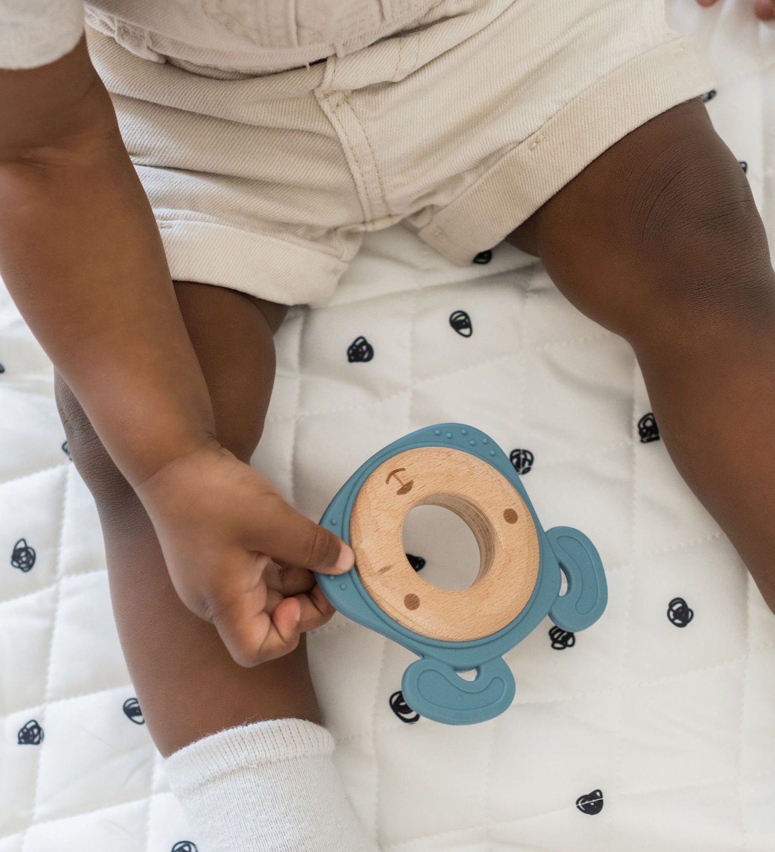 Side-by-side comparison of silicone and wood teethers, highlighting their combined durability and softness