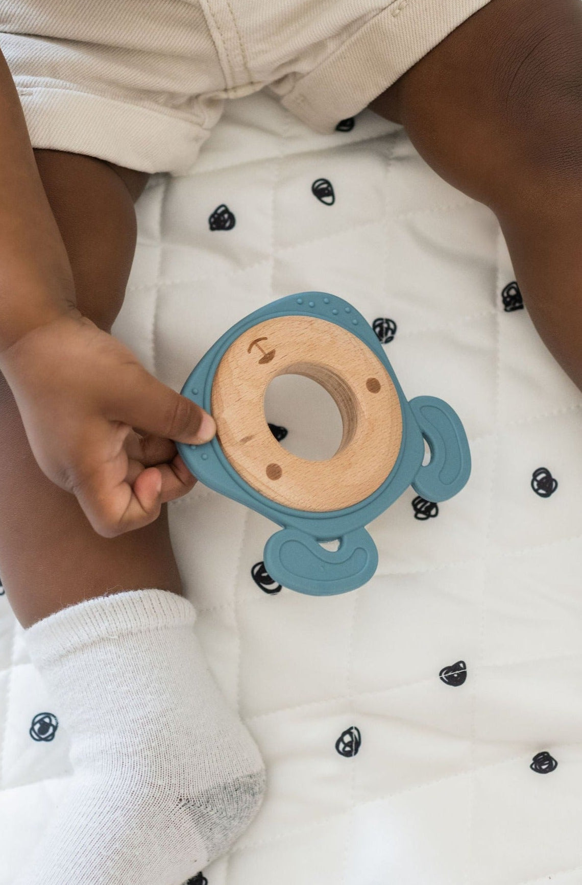 Side-by-side comparison of silicone and wood teethers, highlighting their combined durability and softness