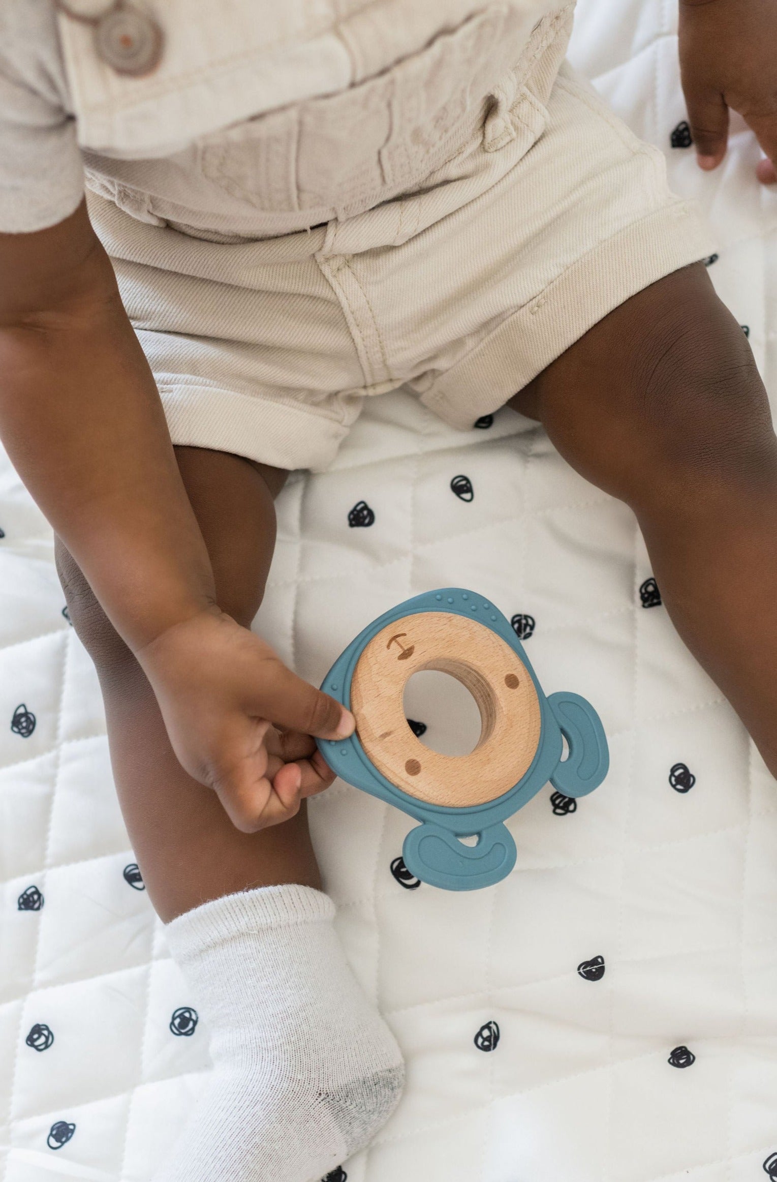 Side-by-side comparison of silicone and wood teethers, highlighting their combined durability and softness