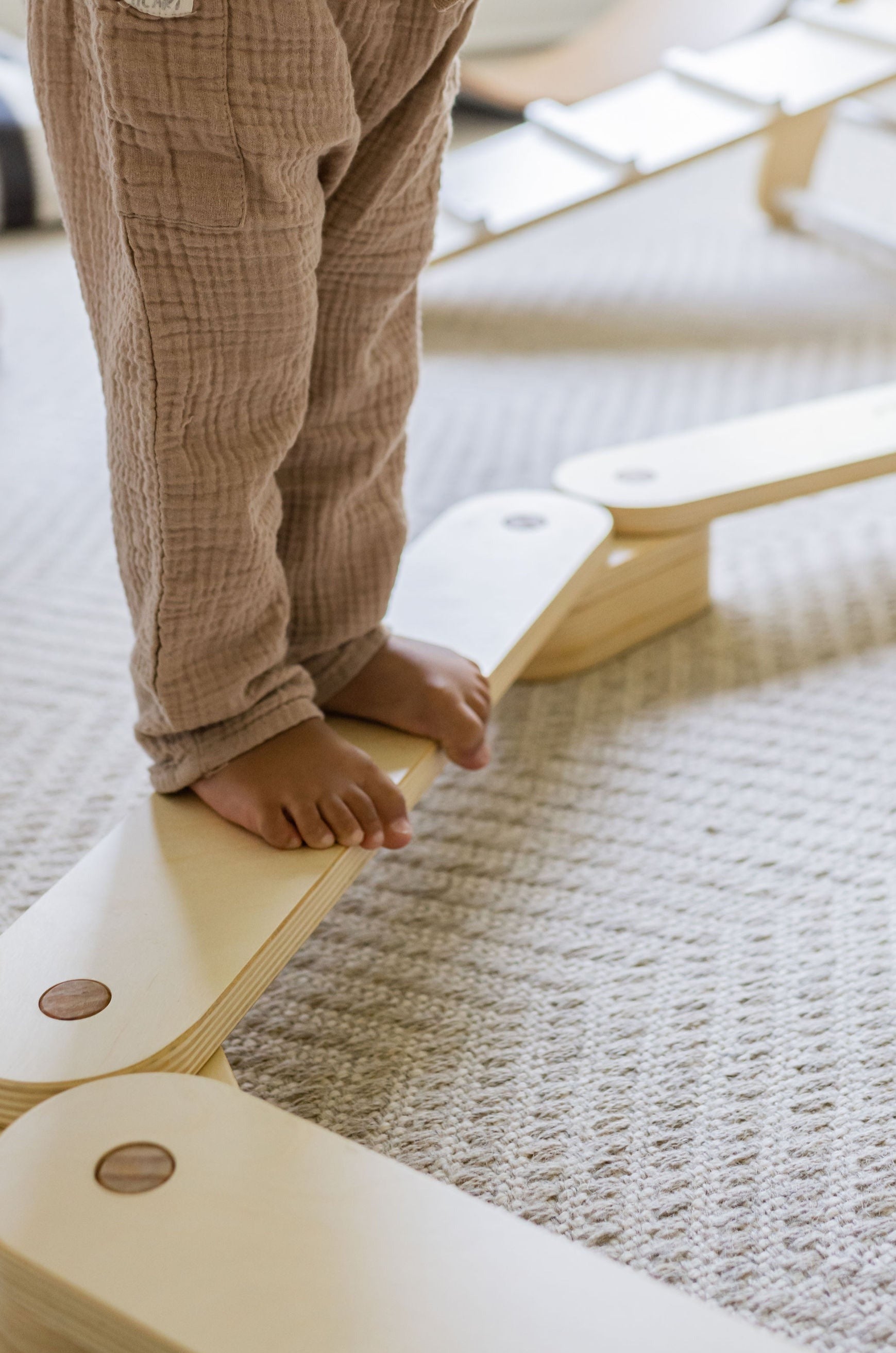 Natural wood balance beam for active play.