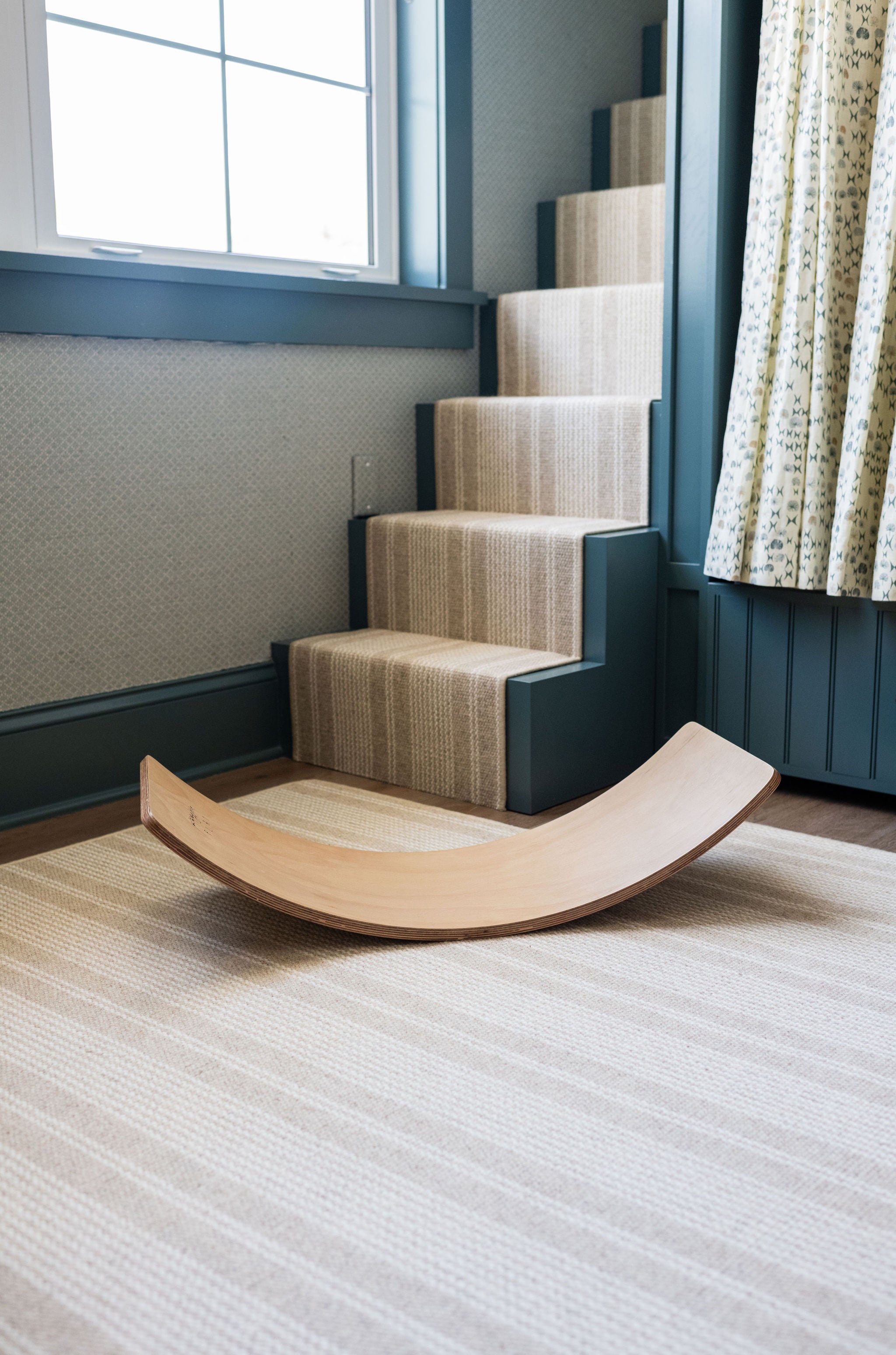 Stylish wooden balance board for kids' coordination.