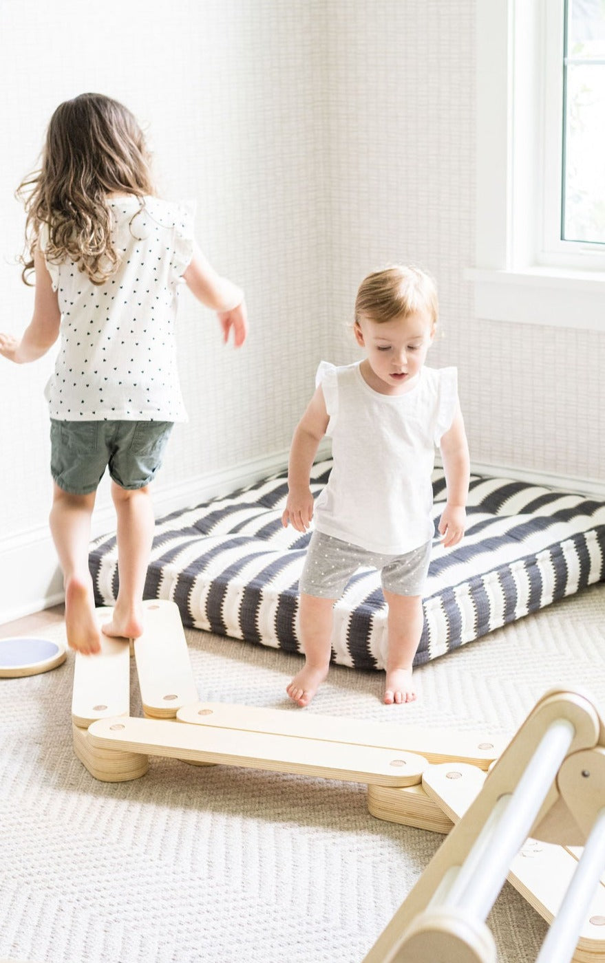 Safe wooden balance beam for early walkers.