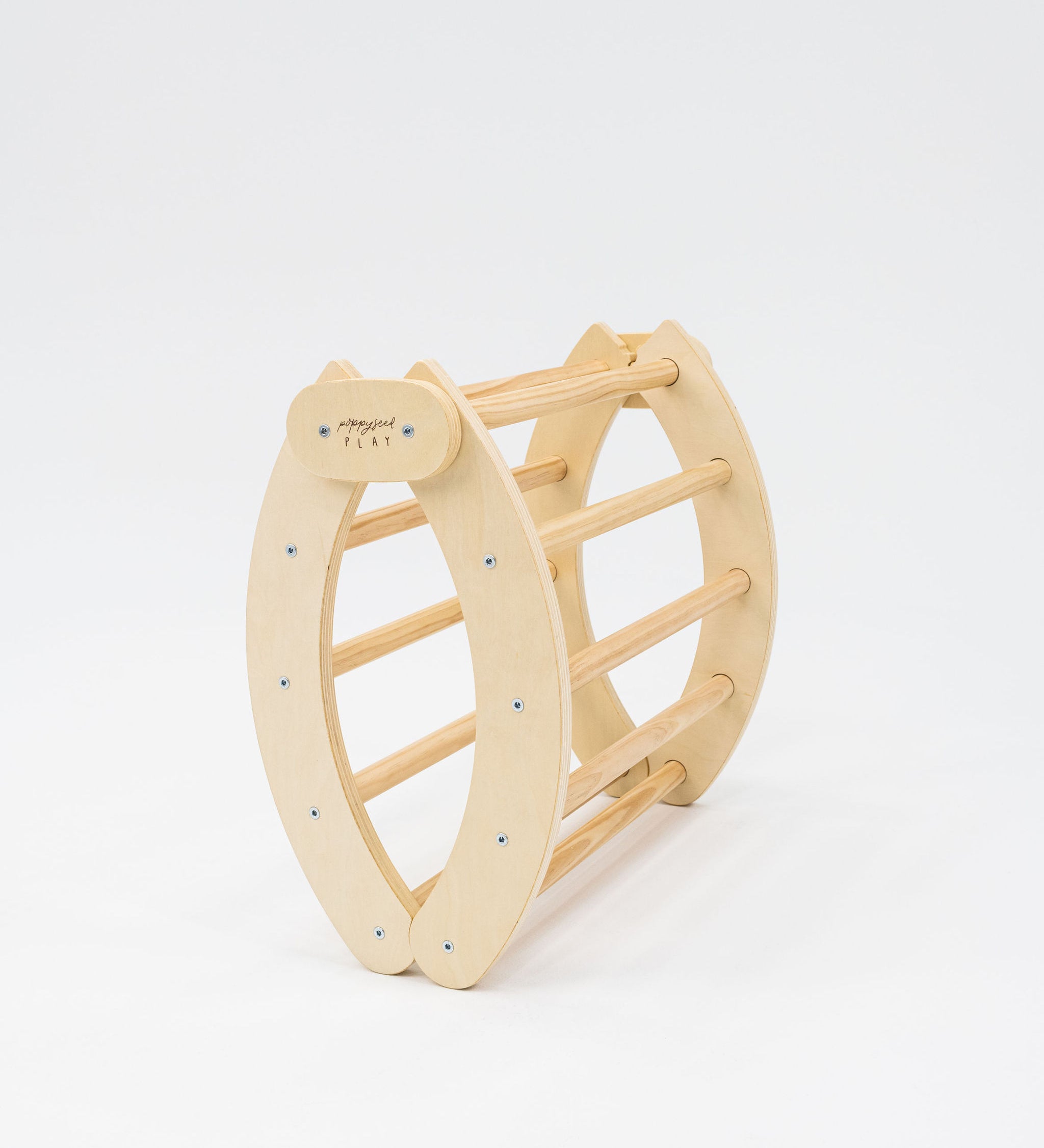 Poppyseed Play Foldable Climbing Arch & Rocker shown in a folded position against a plain white background.