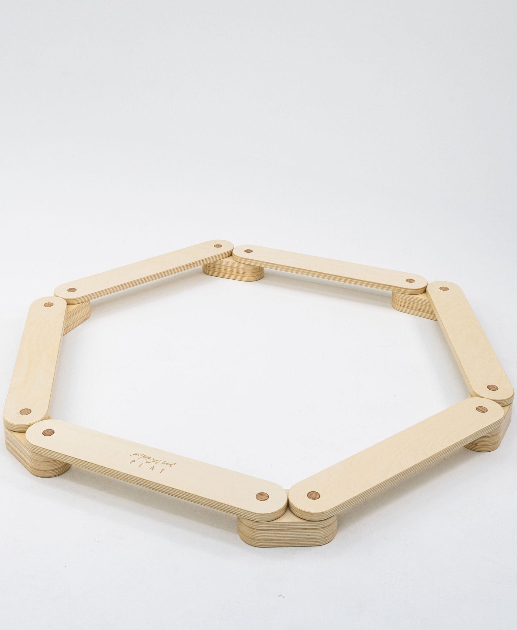 Wooden balance beam designed for children's fun.