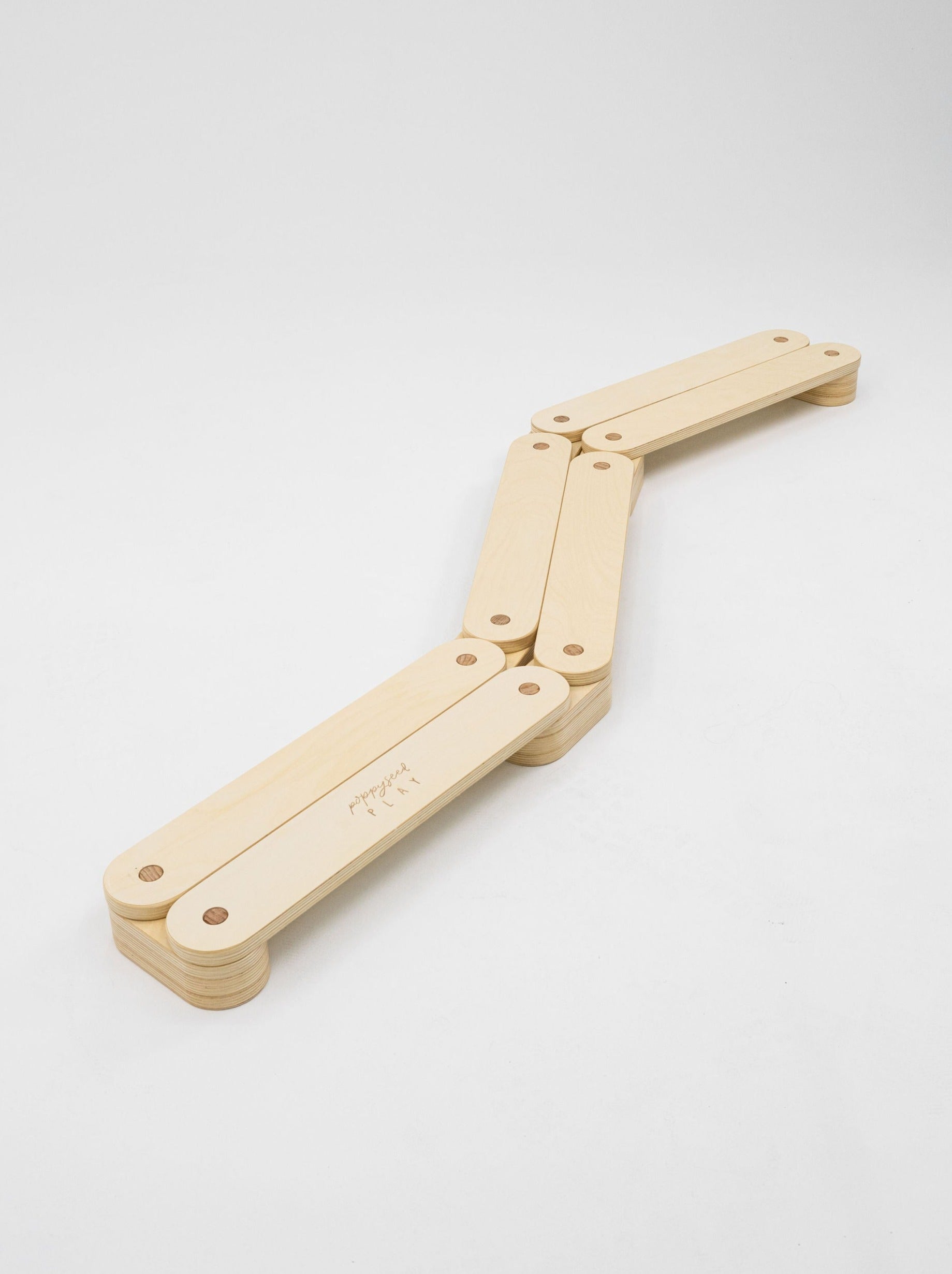 Wooden balance beam promotes balance and agility.