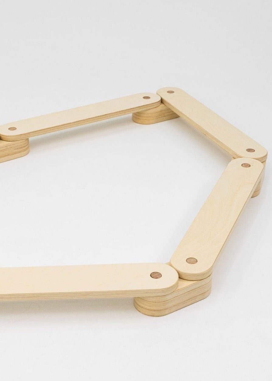 Classic wooden balance beam for developmental play.