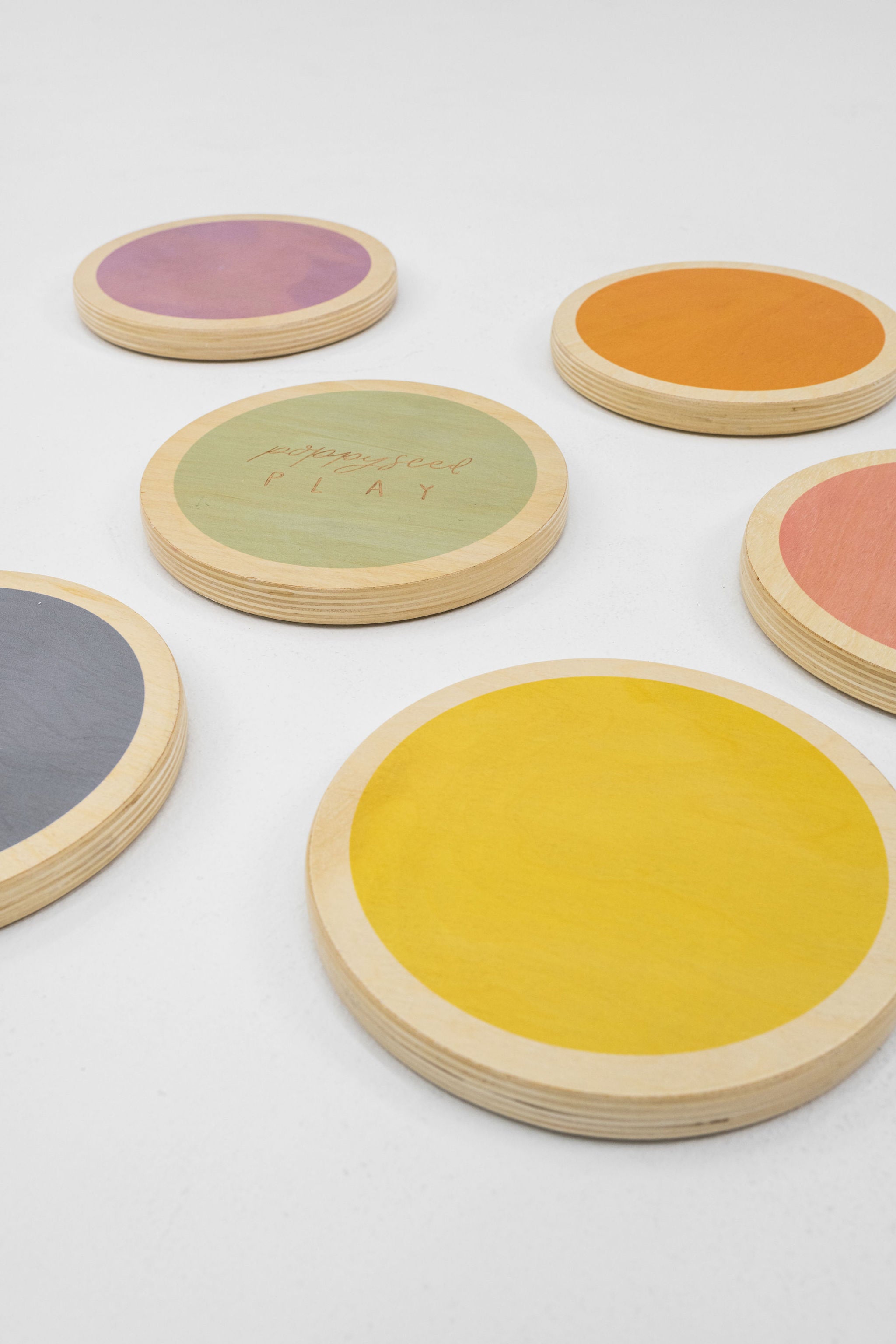 Wood stepping stones displayed in a natural outdoor setting.
