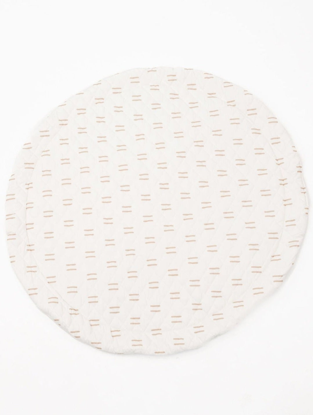 Infant lying comfortably on a thick, padded play mat with educational shapes and textures.