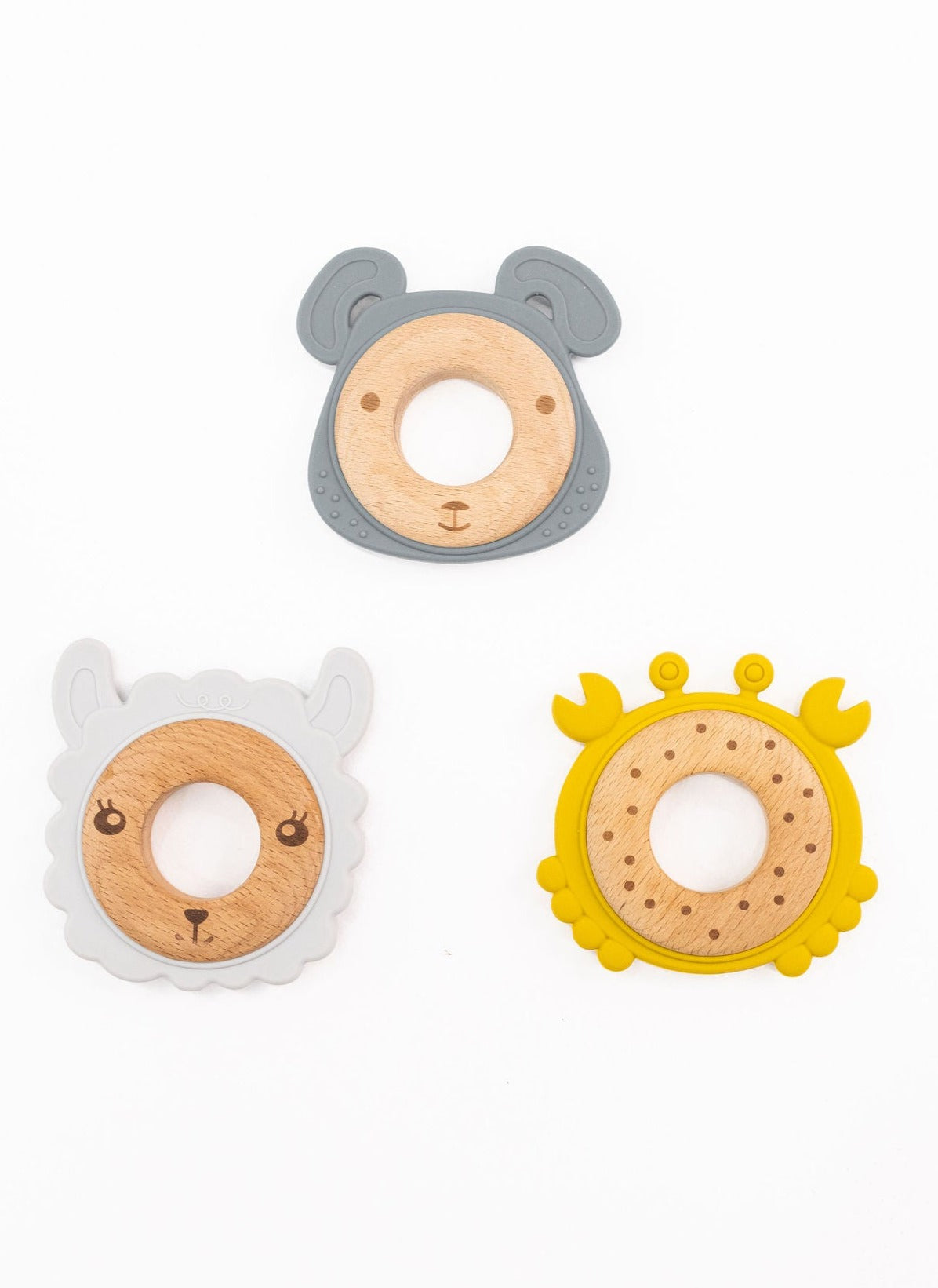 Variety pack of silicone and wood teethers, showing different animal shapes and vibrant colors