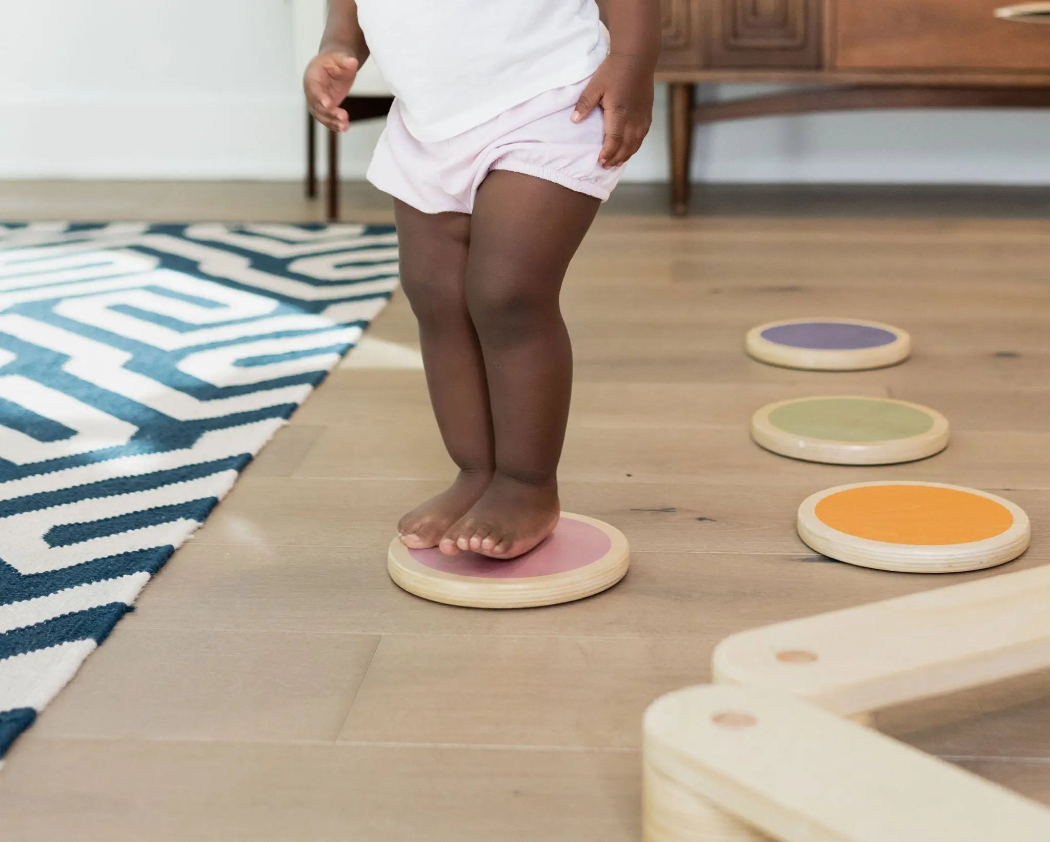 Child Walking on stepping Stones Arranged