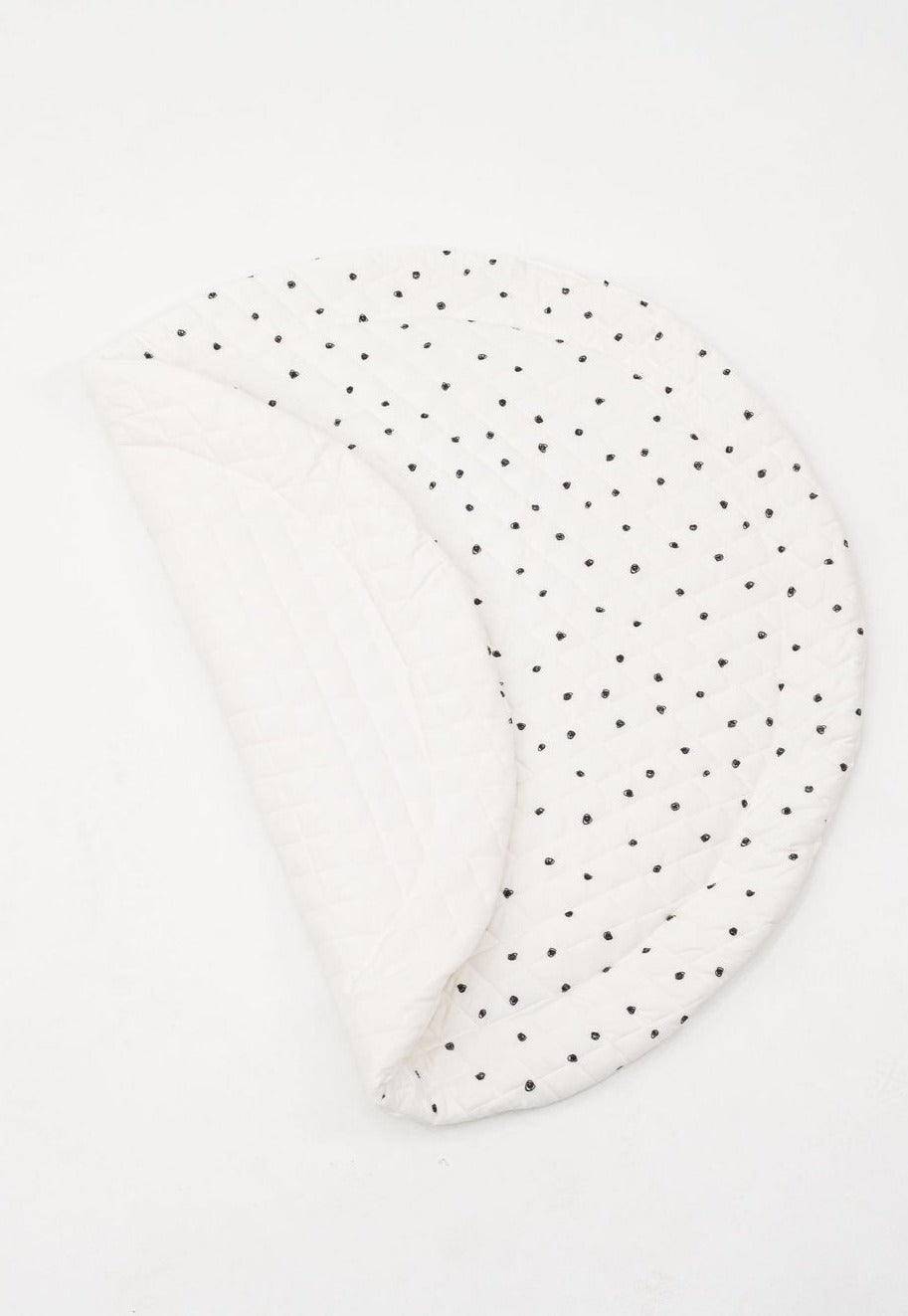 Reversible padded baby play mat with two different designs for versatile play options.
