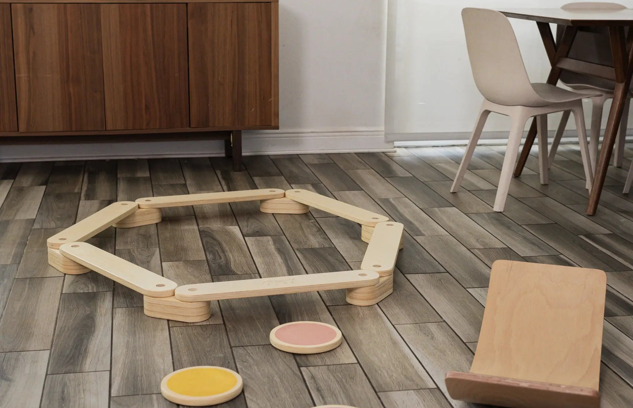 Children playing with the balance beam, stepping stones, and balance board from the Ultimate Balance Bundle.